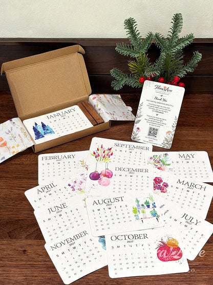 Open gift box with wooden stand and twelve illustrated monthly cards